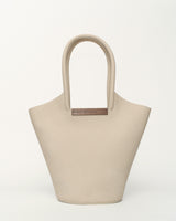 Small garden tote bag in cream made from grained taurillon leather with a walnut wood U bar.