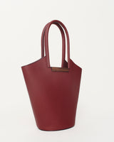Small Garden Tote Bag in Burgundy, crafted from grained leather with a walnut wood U bar, perfect for stylish storage.