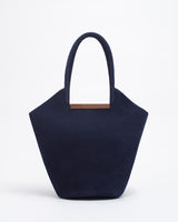 Garden tote bag in dark blue featuring a wooden crafted U bar and spacious design for versatile use.