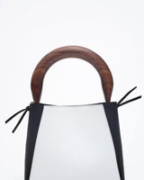 small structured leather quinta bag in black and white walnut handle detail